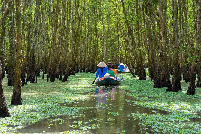Cu Chi Tunnels and Mekong Delta 1 Day Tour from Ho Chi Minh City - Sampan cruising and coconut canal moments