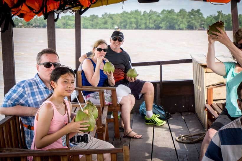 Essential Mekong Delta: Highlight Tour from Ho Chi Minh City - Coconut candy mill + canal boat time: How sweet souvenirs get made