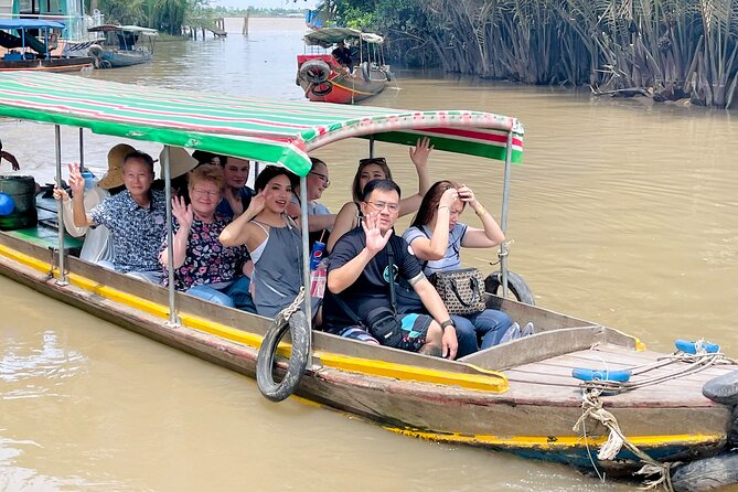 From Ho Chi Minh City: Discover Mekong Delta & Coconut Village - Boat along the Tien River: fish cages, floating houses, and real water time