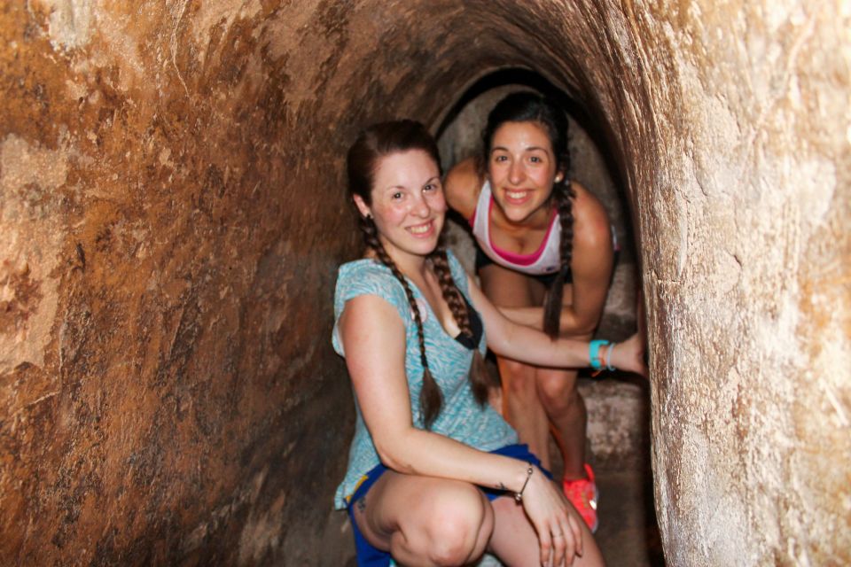 HCM: Cu Chi Tunnels & Mekong Delta with Coconut Village Tour - Coconut village stops: fruit, honey tea, sweets, and folk music