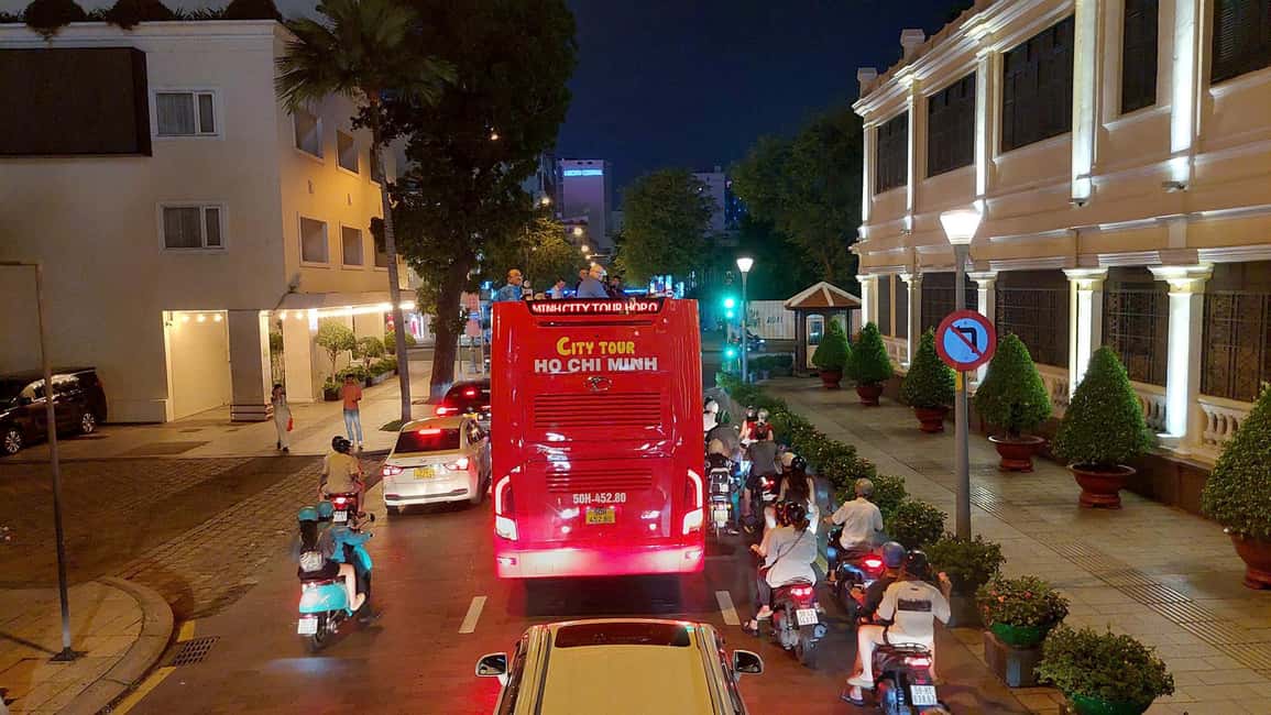 Ho Chi Minh City: Late-Night Open-Top Bus Tour - Open-top comfort: hats, raincoats, and practical night riding