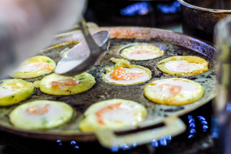 Ho Chi Minh City: Private Street Food Motorbike Tour - Climbing old buildings and peeking into a pagoda in an apartment