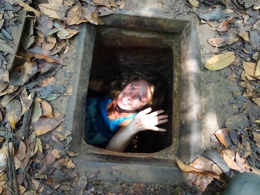 Ho Chi Minh: Cu Chi Tunnels Small-Group Tour & War Veteran - What guides do with the crowd at a busy Cu Chi