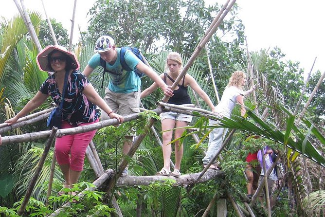 Mekong Delta Boat Tour - Hand-rowed sampan ride: palm-lined channels and real-time scenery