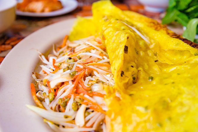 Private Vegan Food Tour By Scooter in Ho Chi Minh City - A Scooter-Back View of Saigon After Dark