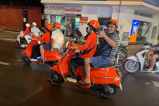 Saigon Vespa By Night Street Food With Female Riders Ao Dai - Stop-by-stop food plan: seafood first, then Saigon signatures