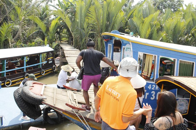 Shared Cu Chi Tunnels & Mekong Delta Tour Full Day - Motorboat and rowing sampan: the part worth prioritizing