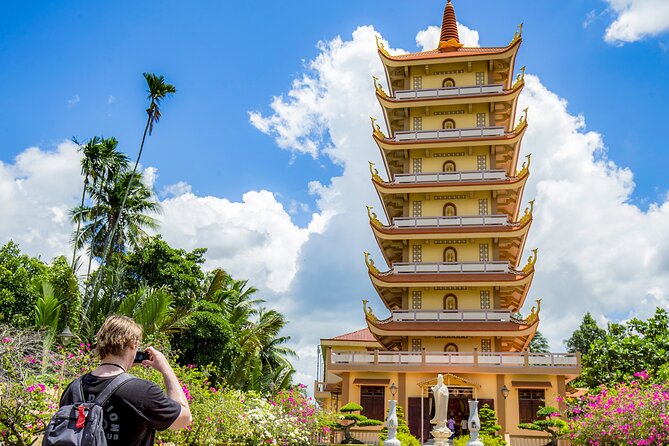 Small-Group Mekong Delta Day Trip: Boat Ride, Cottages & Pagoda - Boat rides and the Rạch Miễu Bridge moment