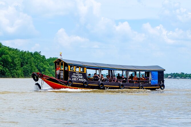 Small-Group Mekong Delta Day Trip: Boat Ride, Cottages & Pagoda - Vĩnh Tràng Pagoda: the architecture stop you can’t skip